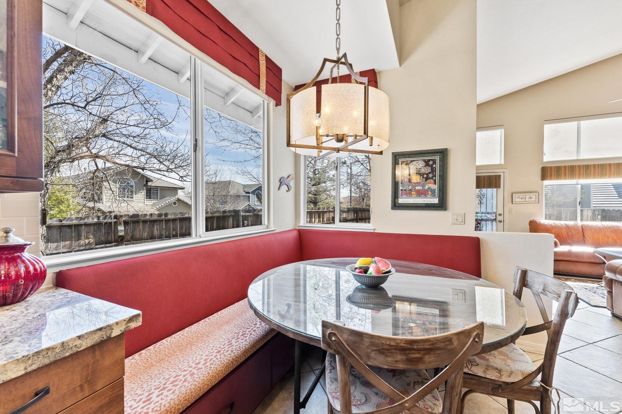 6444 Brookview Circle Reno, NV 89519 - Photo 5 of 32 a view of a dining room with furniture a chandelier and wooden floor