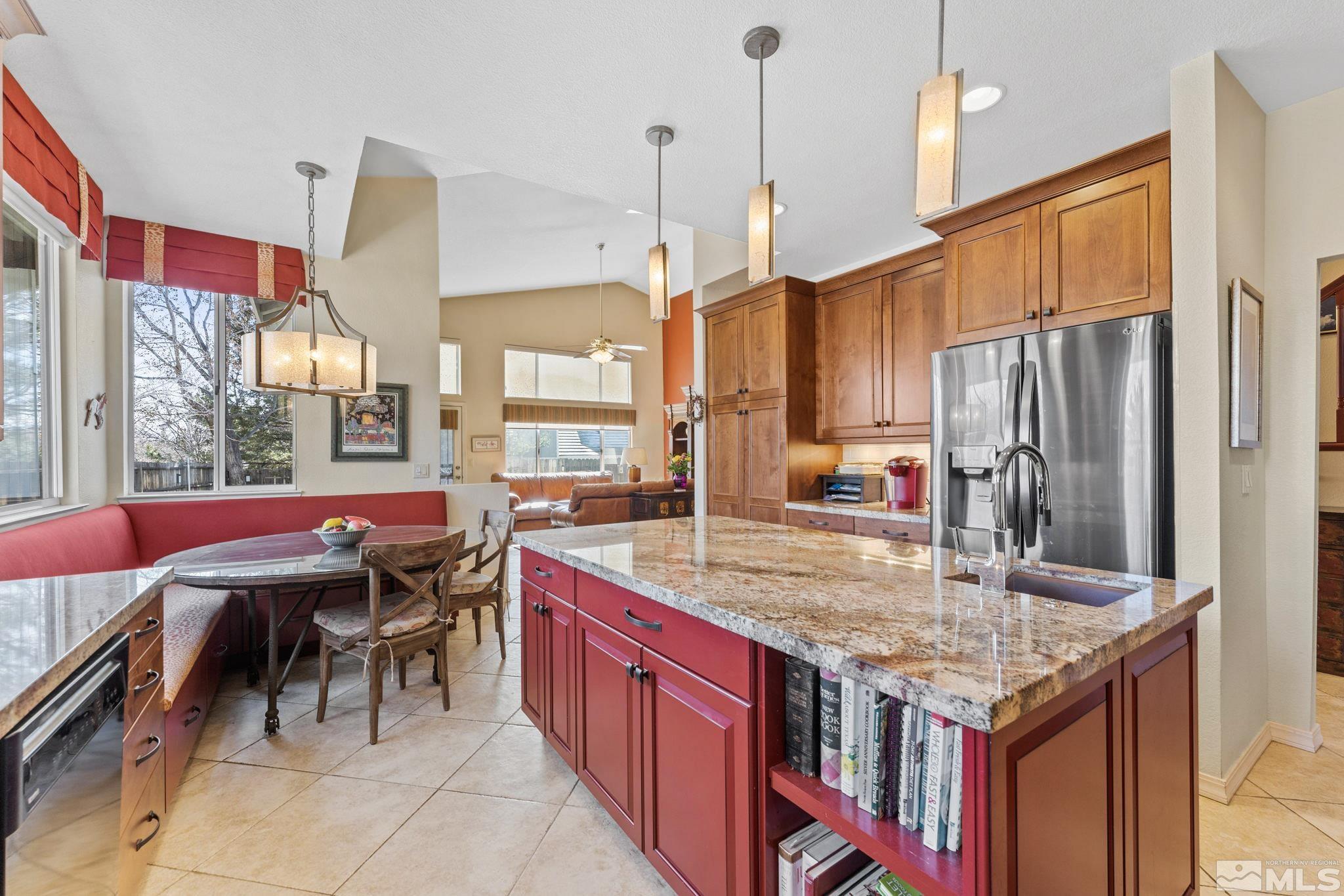 6444 Brookview Circle Reno, NV 89519 - Photo 6 of 32 a kitchen with stainless steel appliances granite countertop a kitchen island a large stove a sink dishwasher and cabinets with wooden floor