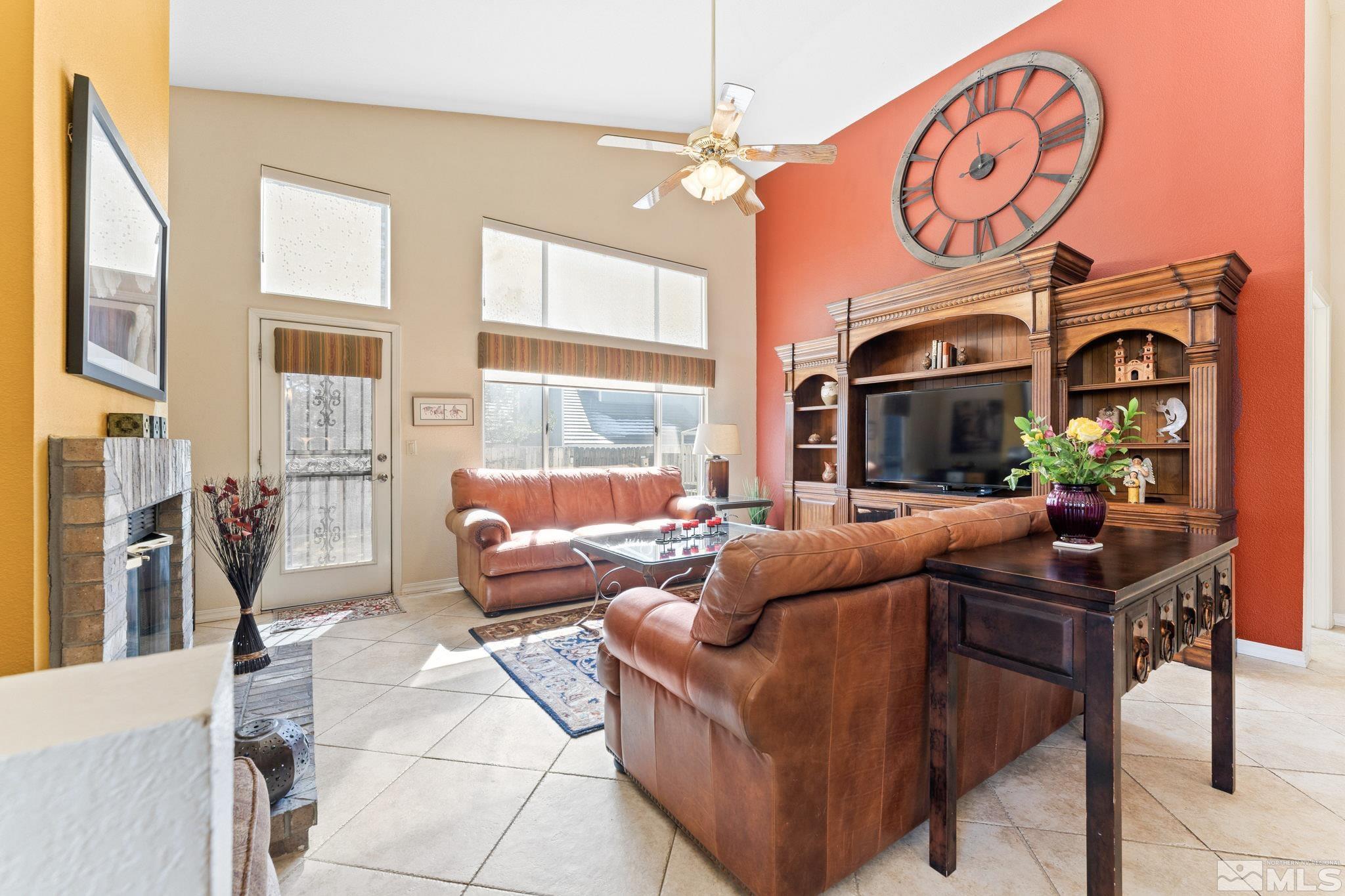 6444 Brookview Circle Reno, NV 89519 - Photo 7 of 32 a living room with fireplace furniture and a large window
