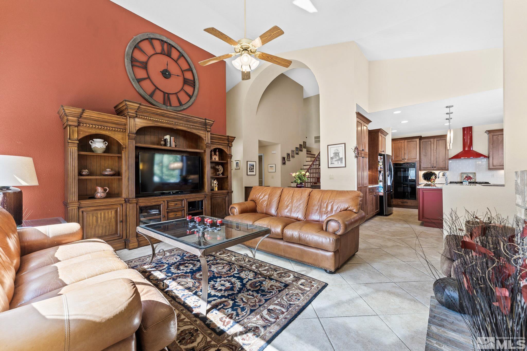 6444 Brookview Circle Reno, NV 89519 - Photo 8 of 32 a living room with furniture and a flat screen tv