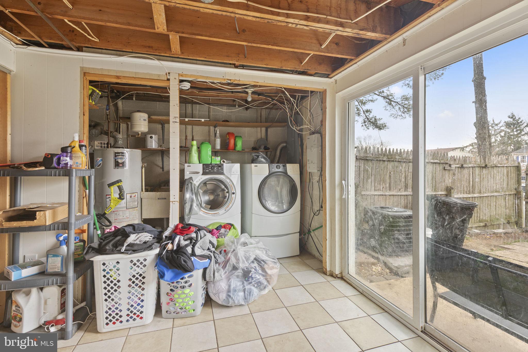 9 Slavin Court, Unit 2H Nottingham, MD 21236 - Photo 15 of 22 a room with lots of books and large windows