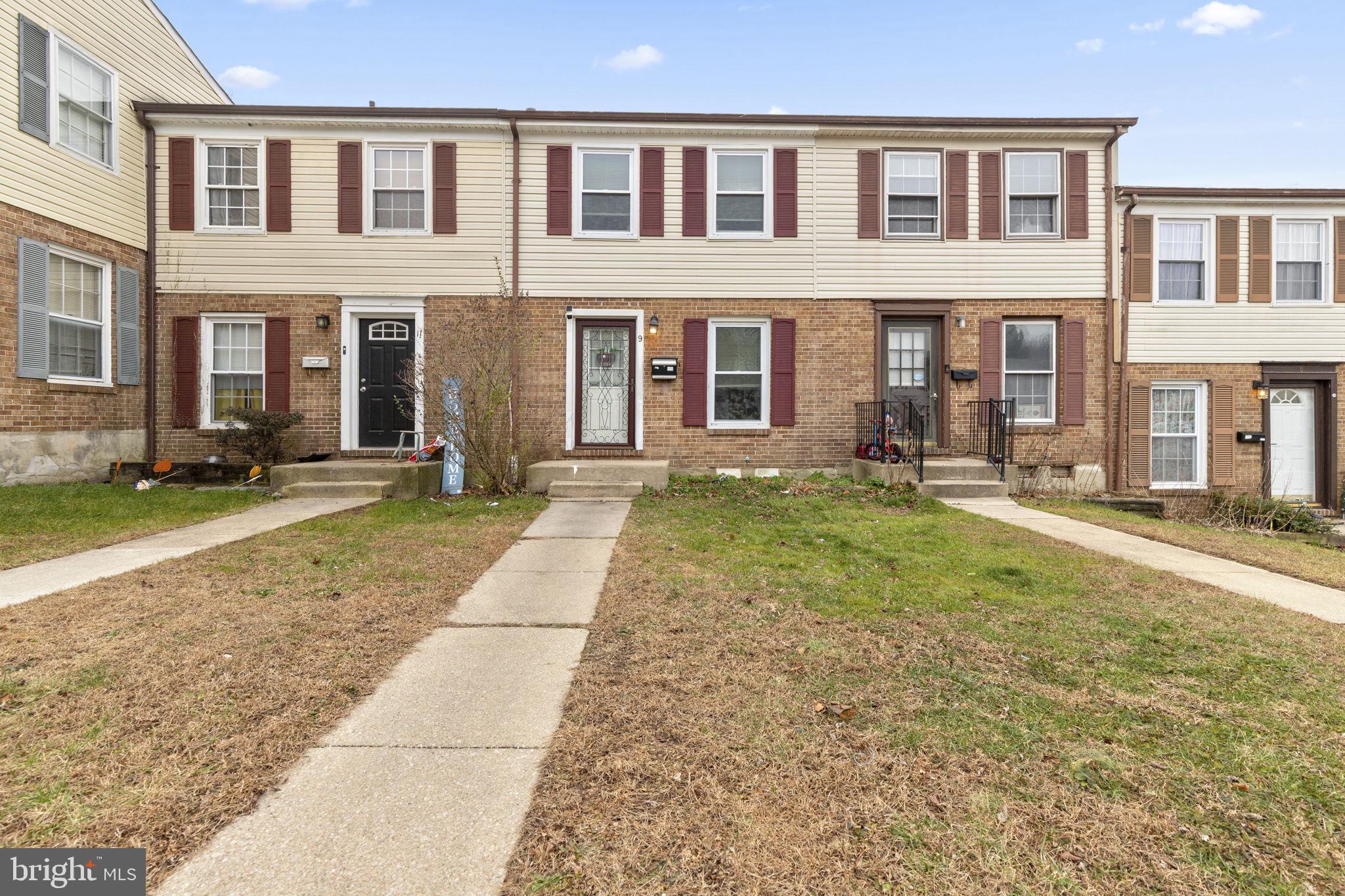 9 Slavin Court, Unit 2H Nottingham, MD 21236 - Photo 18 of 22 a view of a brick building next to a yard