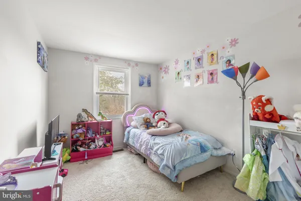 a bedroom with toys and a couch