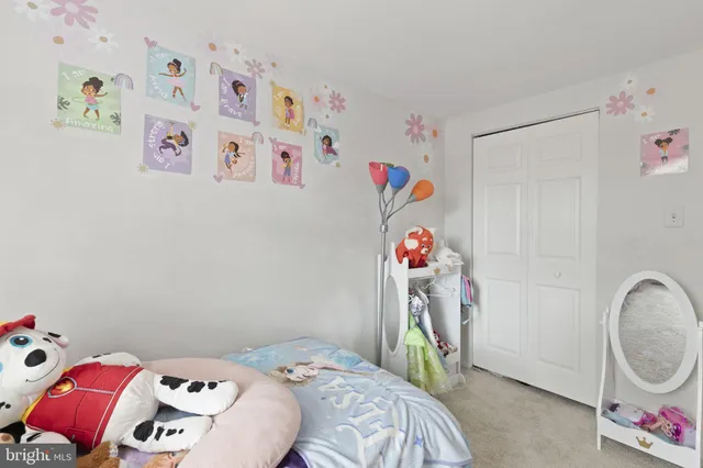 a bedroom with a bed and a closet