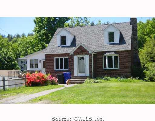 33 Norfolk Road Torrington, CT 06790 - Photo 1 of 1 a backyard with a garden and plants