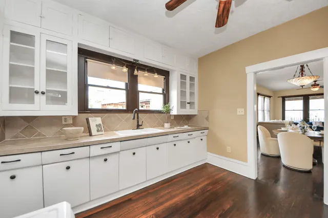 a kitchen with a sink dishwasher and a granite counter top