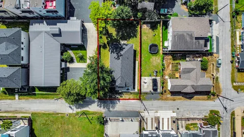 an aerial view of houses with yard