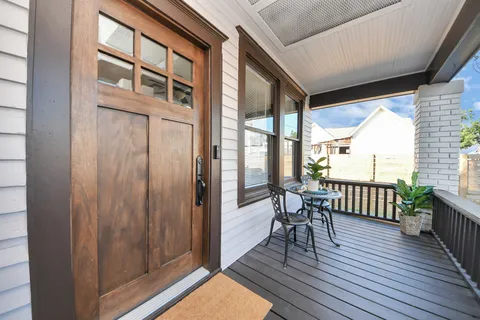 a view of a balcony with wooden floor