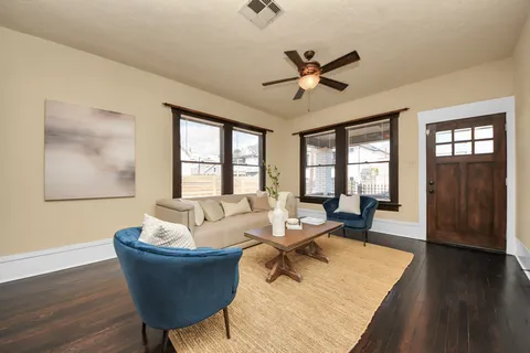 a living room with furniture and a window
