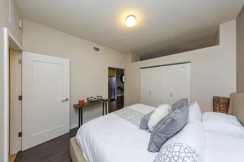 a bedroom with a bed and a table in it