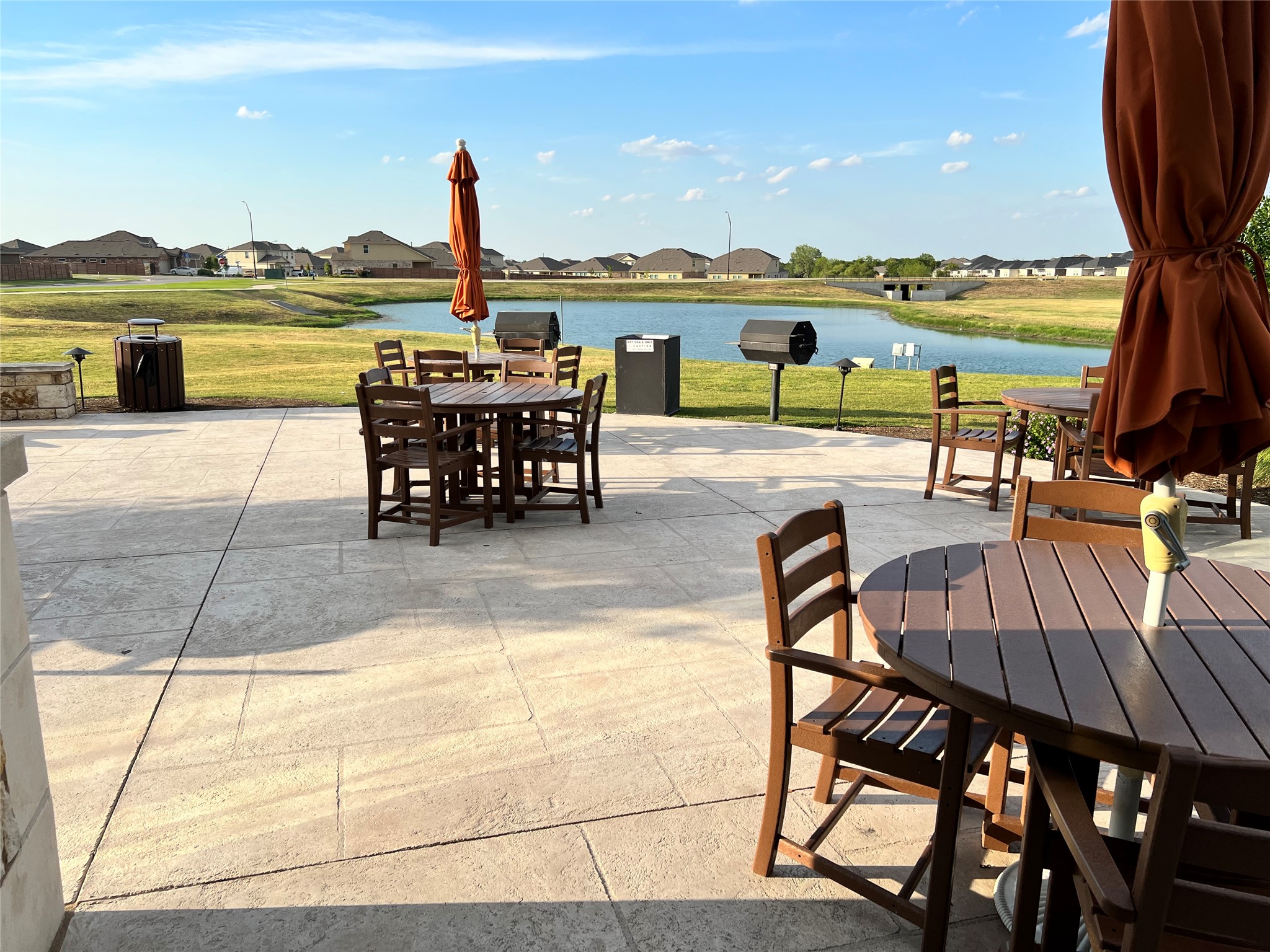 140 Pentro Path Georgetown, TX 78626 - Photo 25 of 37 Enjoy outdoor dining and relaxation on this generous patio overlooking a tranquil pond.
