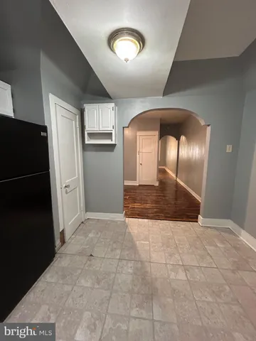 a view of empty room with a fireplace