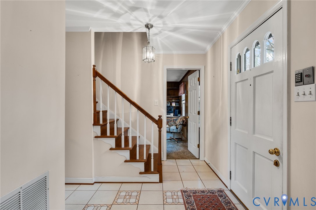 1913 Raintree Drive Henrico, VA 23238 - Photo 11 of 39 a view of a hallway with windows and stairs