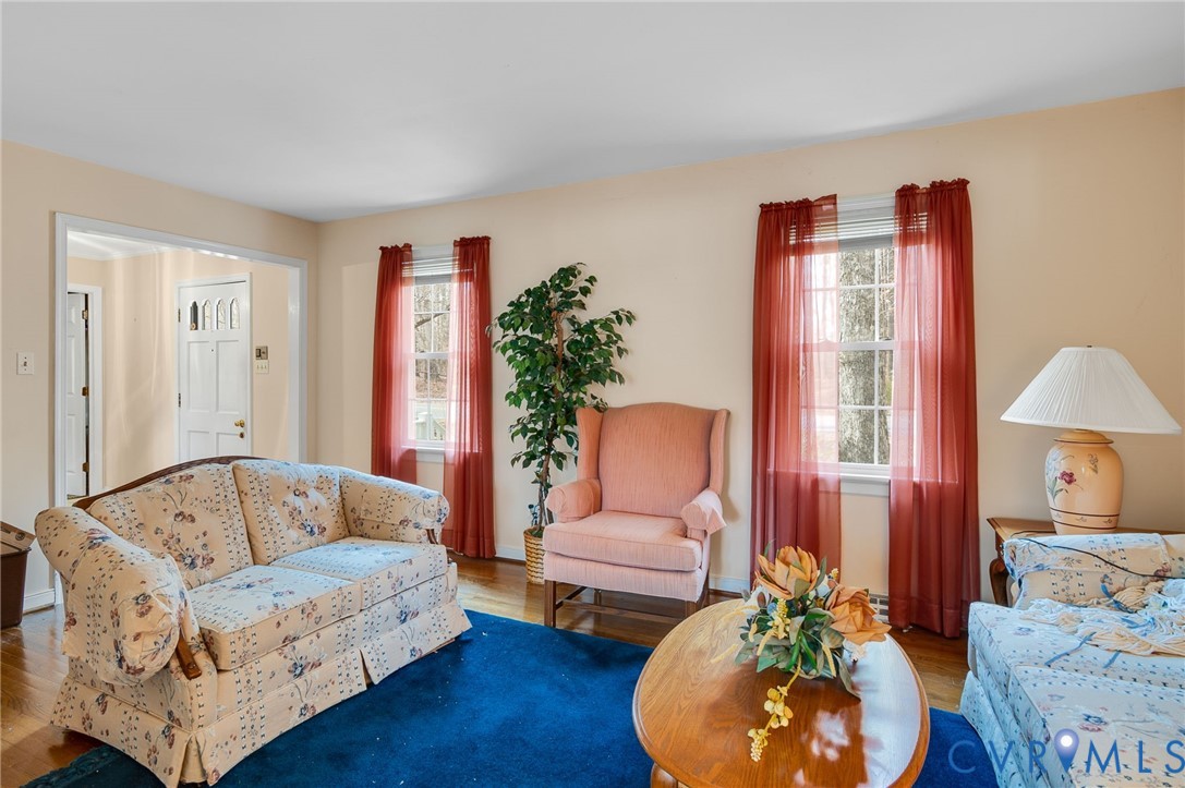 1913 Raintree Drive Henrico, VA 23238 - Photo 13 of 39 a living room with furniture and a wooden floor
