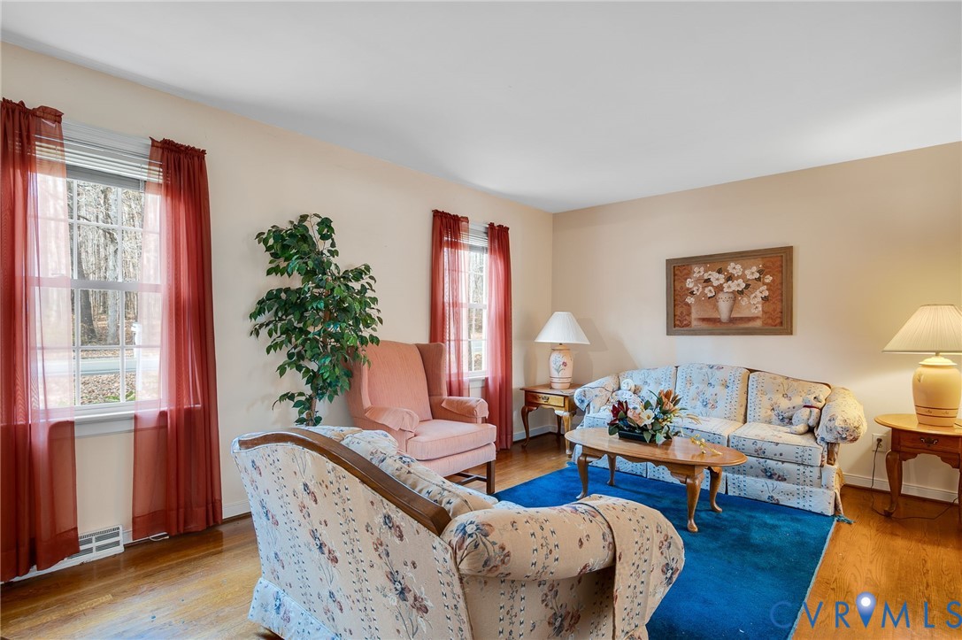 1913 Raintree Drive Henrico, VA 23238 - Photo 14 of 39 a living room with furniture and a potted plant