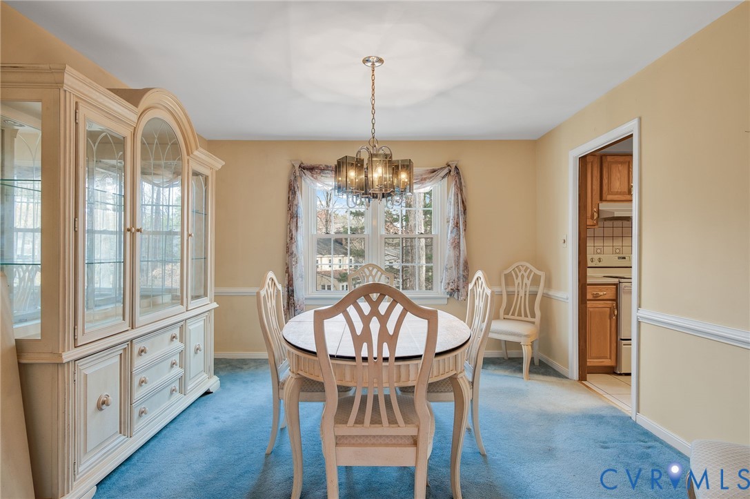 1913 Raintree Drive Henrico, VA 23238 - Photo 15 of 39 a view of a dining room with furniture window and wooden floor