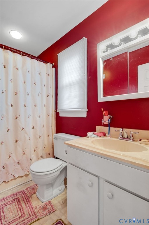 1913 Raintree Drive Henrico, VA 23238 - Photo 28 of 39 a bathroom with a sink a toilet and mirror