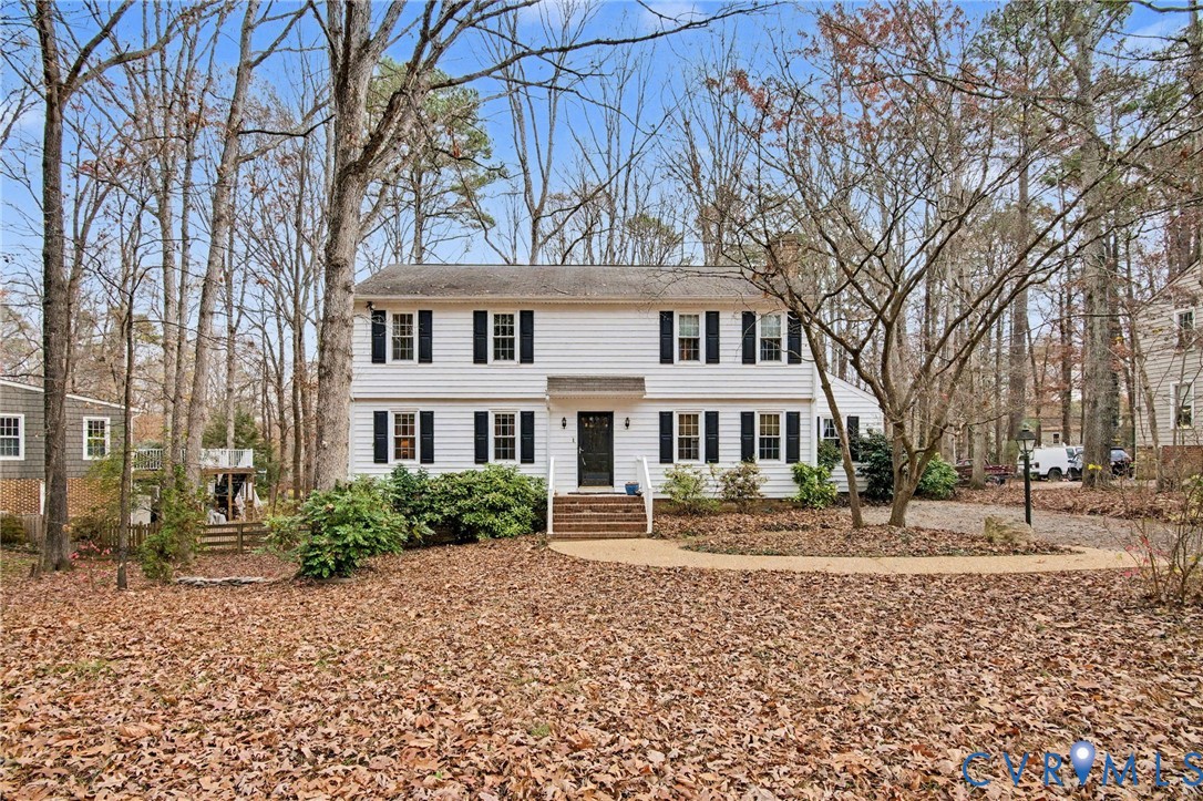 1913 Raintree Drive Henrico, VA 23238 - Photo 3 of 39 a front view of a house with a yard