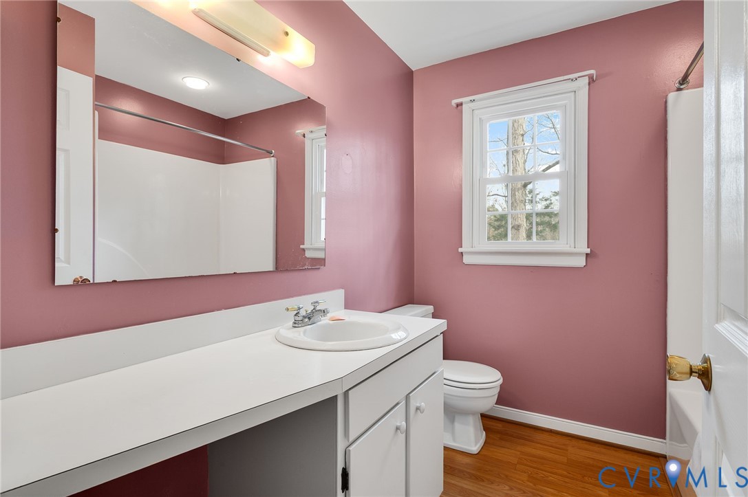 1913 Raintree Drive Henrico, VA 23238 - Photo 32 of 39 a bathroom with a sink a toilet and mirror
