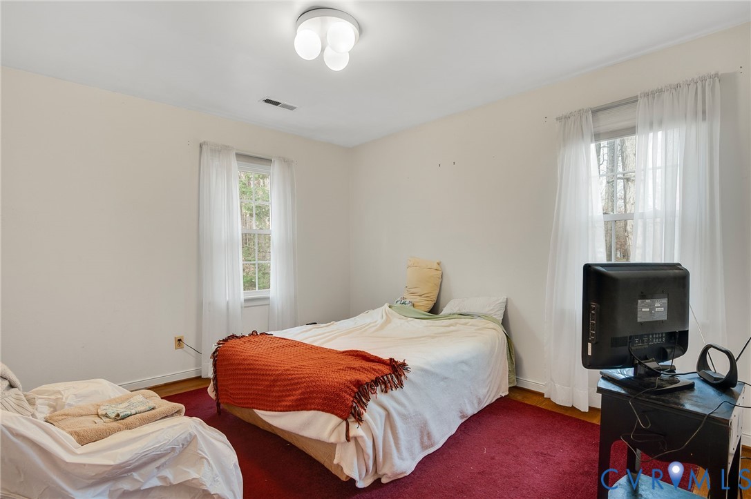 1913 Raintree Drive Henrico, VA 23238 - Photo 33 of 39 a bedroom with bed and a window