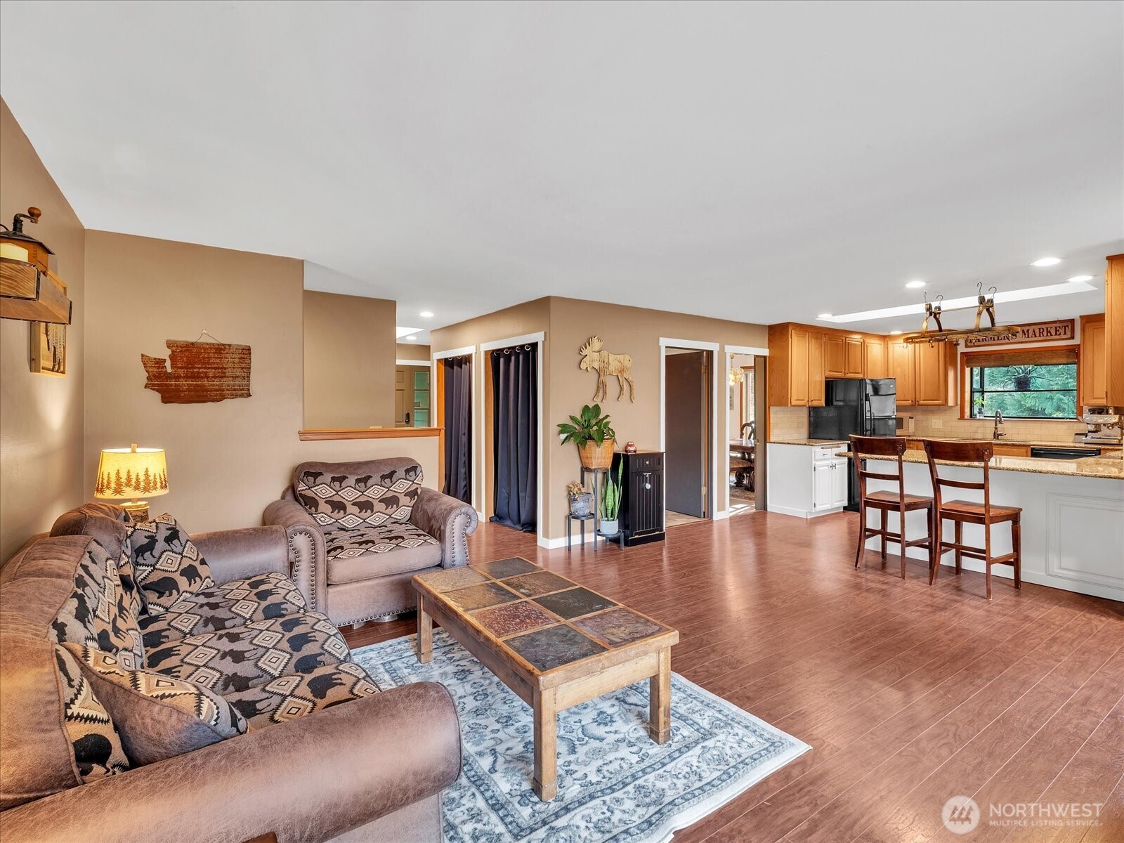 7417 Silvana Terrace Road Stanwood, WA 98292 - Photo 14 of 38 a living room with furniture and wooden floor