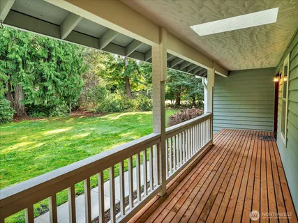 a view of balcony with wooden floor