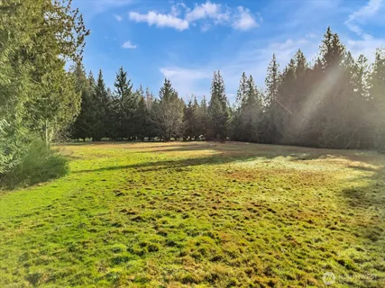 a view of a swimming pool with an outdoor space and seating area