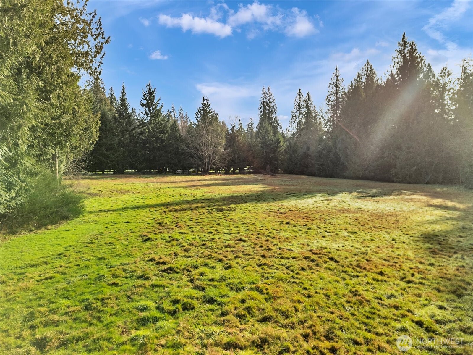 7417 Silvana Terrace Road Stanwood, WA 98292 - Photo 31 of 38 a view of a swimming pool with an outdoor space and seating area