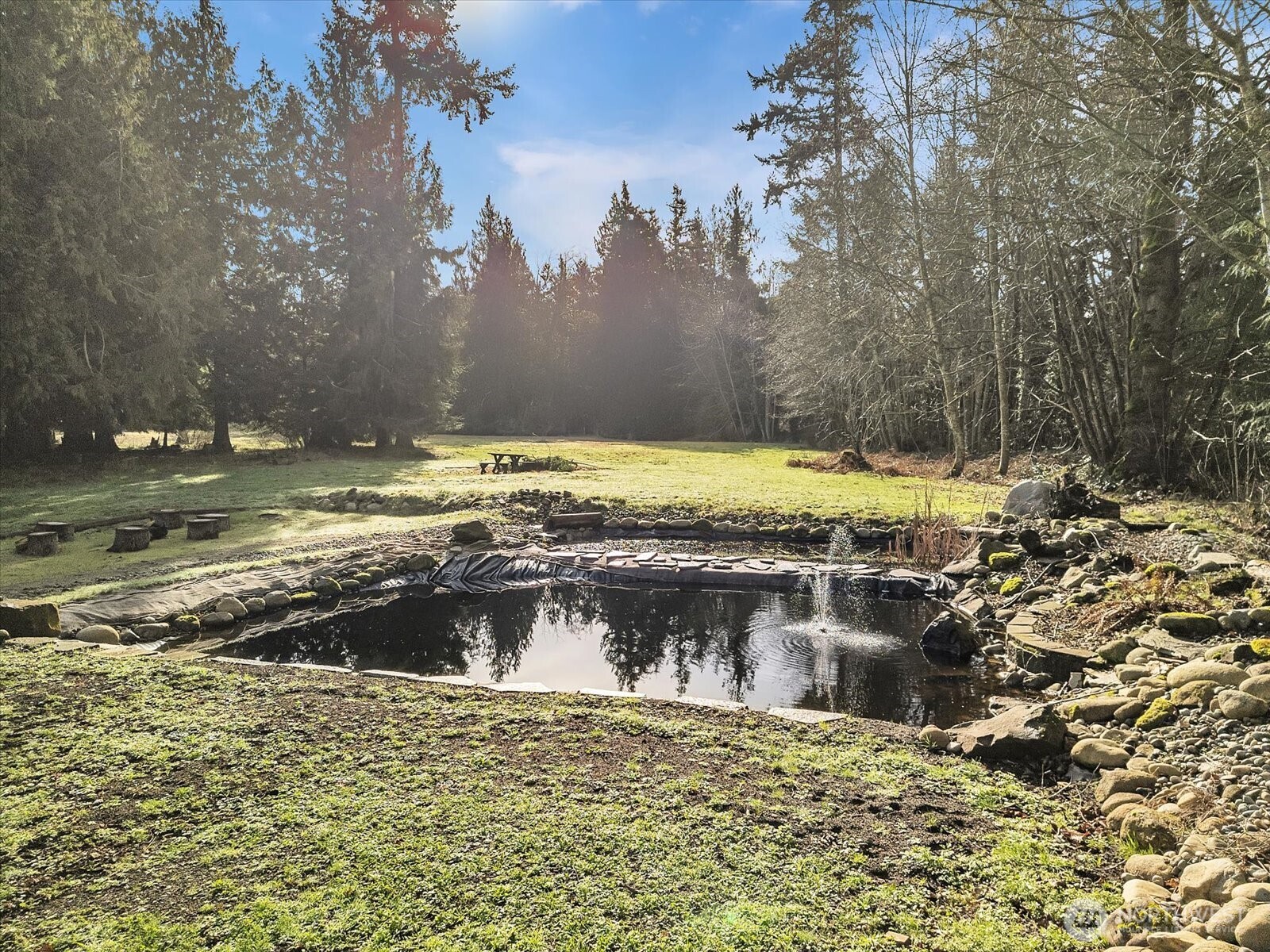 7417 Silvana Terrace Road Stanwood, WA 98292 - Photo 4 of 38 a view of a swimming pool with a yard