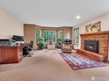 a living room with furniture or couch and a fireplace