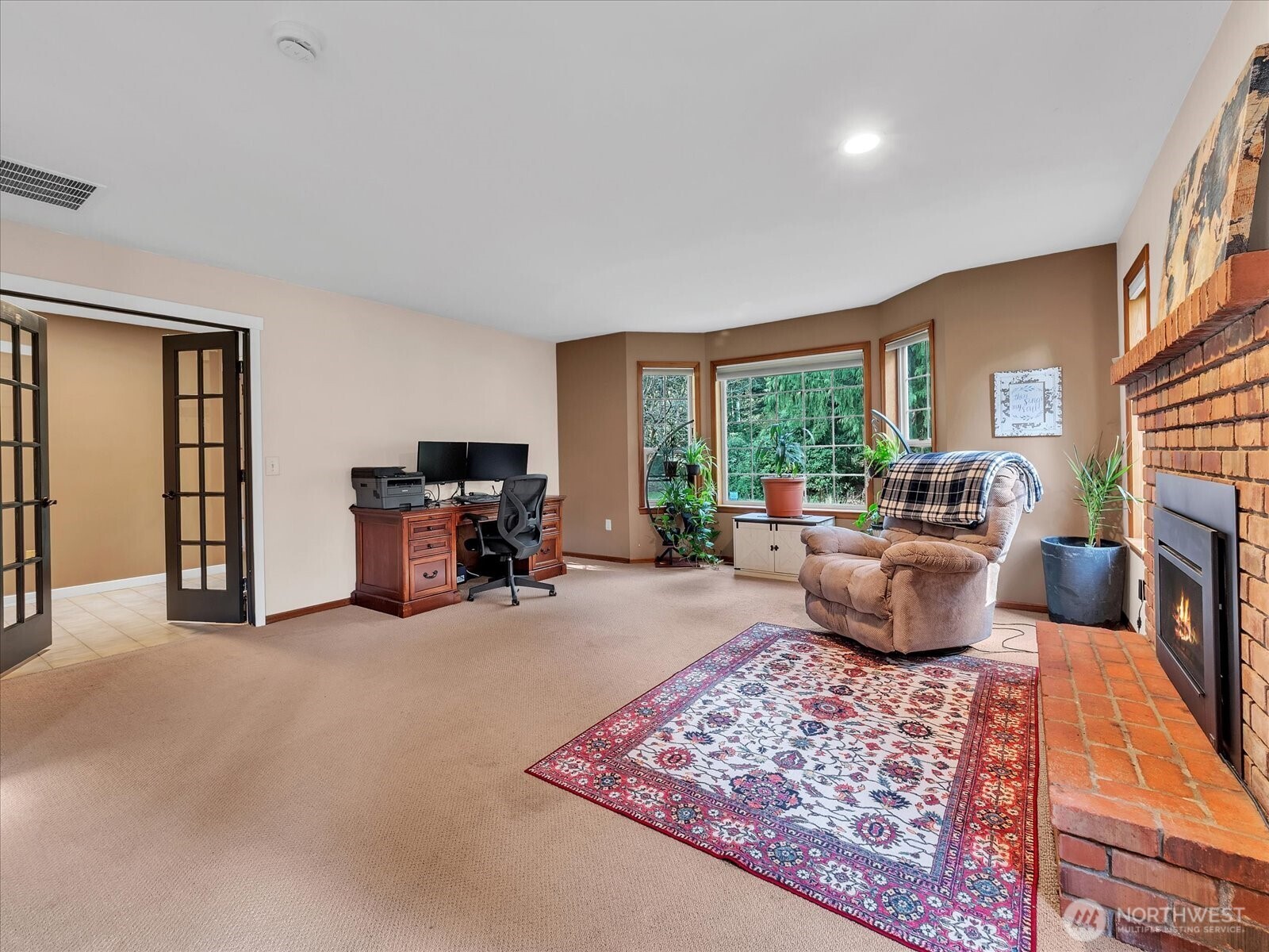 7417 Silvana Terrace Road Stanwood, WA 98292 - Photo 8 of 38 a living room with furniture large window and a table