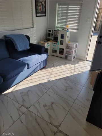 a bedroom with bed and window