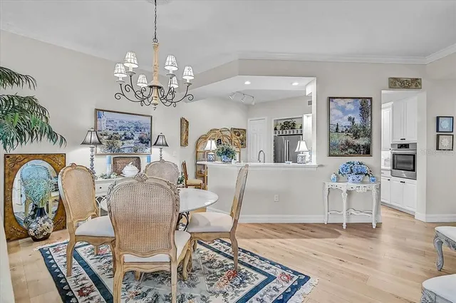 a kitchen with stainless steel appliances kitchen island granite countertop a refrigerator and a sink