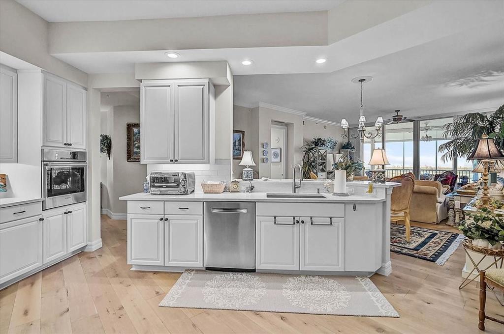 409 North Point Road, Unit 902 Osprey, FL 34229 - Photo 15 of 59 a large white kitchen with lots of counter space and appliances