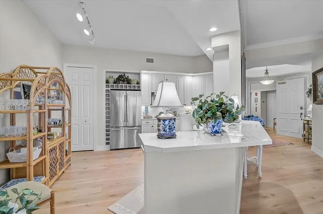 a spacious bathroom with a granite countertop sink a mirror and shower