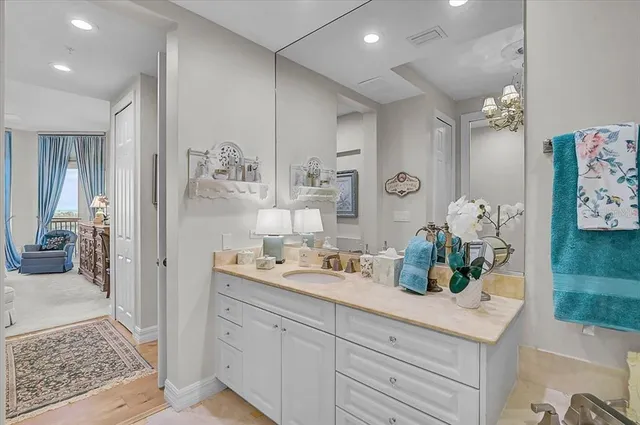 a bedroom with a large bed and a couch