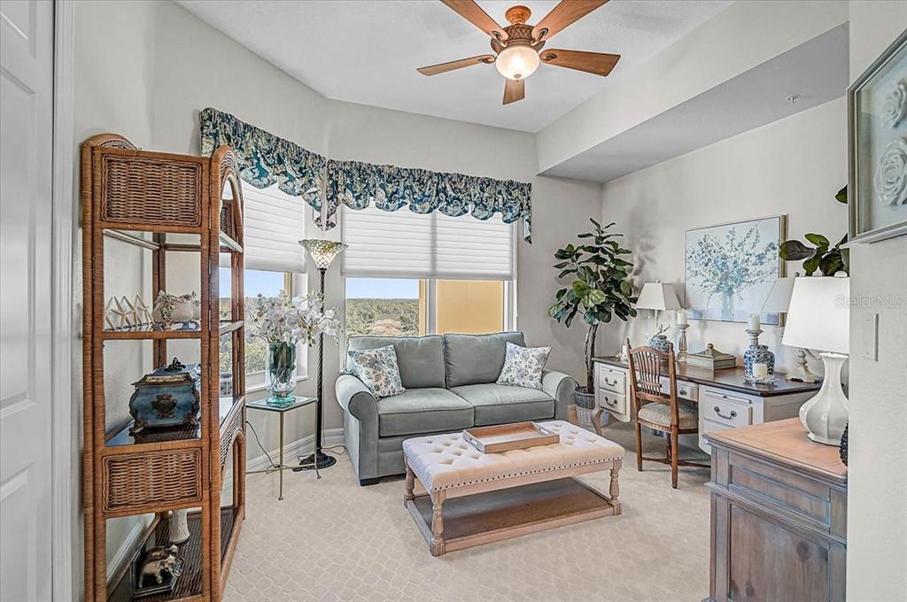409 North Point Road, Unit 902 Osprey, FL 34229 - Photo 23 of 59 a living room with furniture and a large window