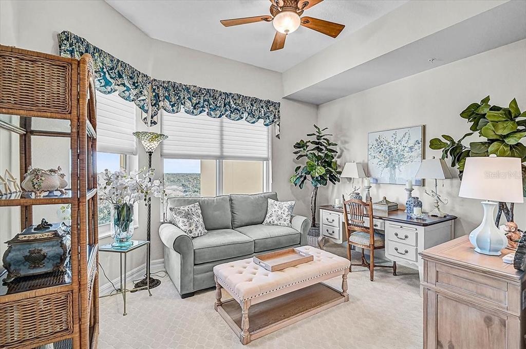 409 North Point Road, Unit 902 Osprey, FL 34229 - Photo 24 of 59 a living room with furniture and a large window