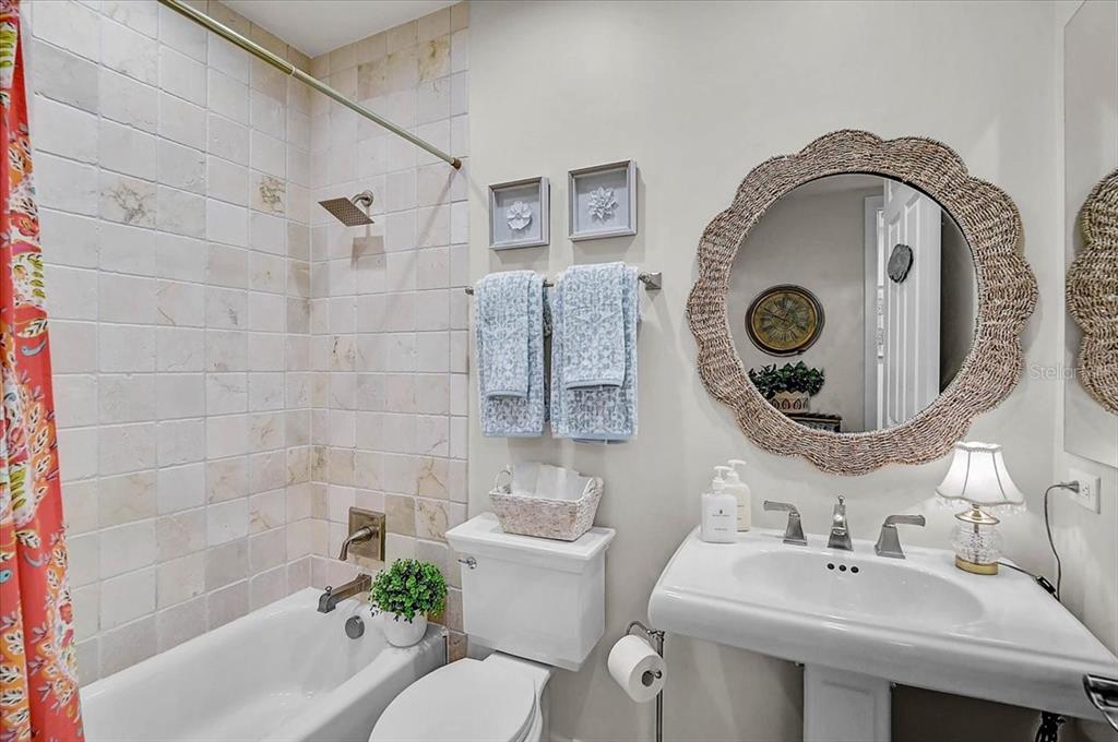 409 North Point Road, Unit 902 Osprey, FL 34229 - Photo 25 of 59 a bathroom with a sink and a mirror