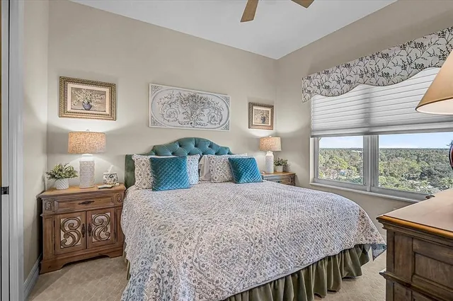 a dining room with furniture window and outside view