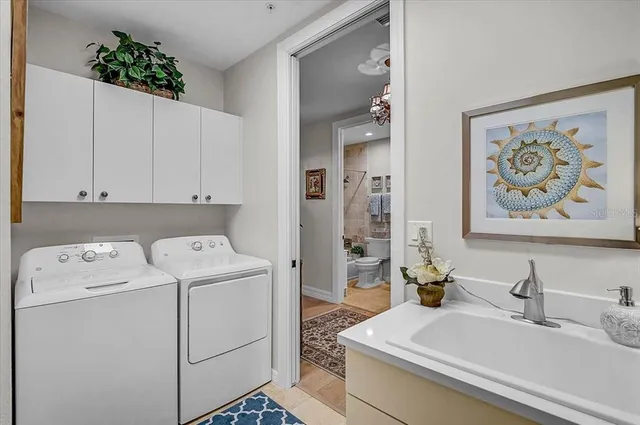 a spacious bathroom with a tub and large windows