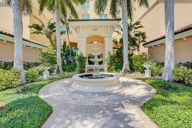 a dining room with furniture water view and balcony