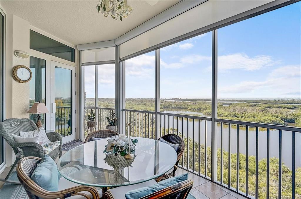 409 North Point Road, Unit 902 Osprey, FL 34229 - Photo 4 of 59 a dining room with furniture water view and balcony