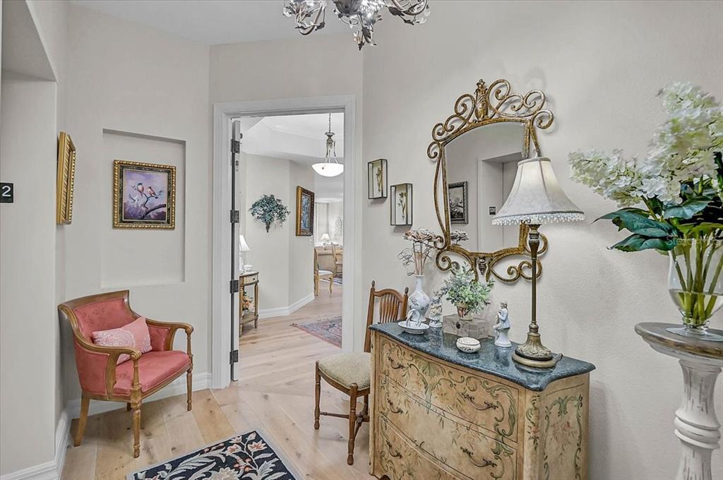 409 North Point Road, Unit 902 Osprey, FL 34229 - Photo 7 of 59 a living room with furniture flowerpot and a chandelier