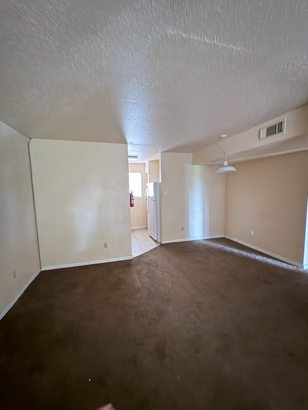 7201 Hallshire Drive, Unit 222 Houston, TX 77016 - Photo 16 of 20 a view of an empty room with a kitchen