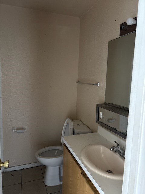 7201 Hallshire Drive, Unit 222 Houston, TX 77016 - Photo 18 of 20 a bathroom with a sink and toilet