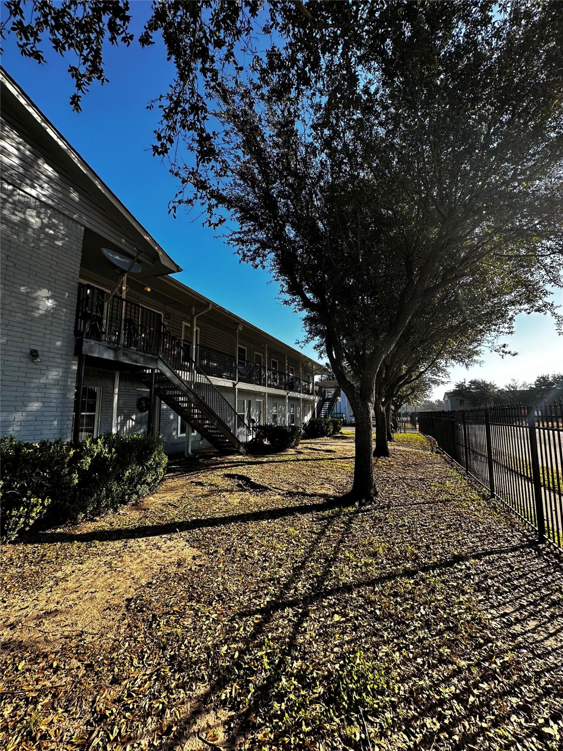 7201 Hallshire Drive, Unit 222 Houston, TX 77016 - Photo 3 of 20 a view of a house with a yard