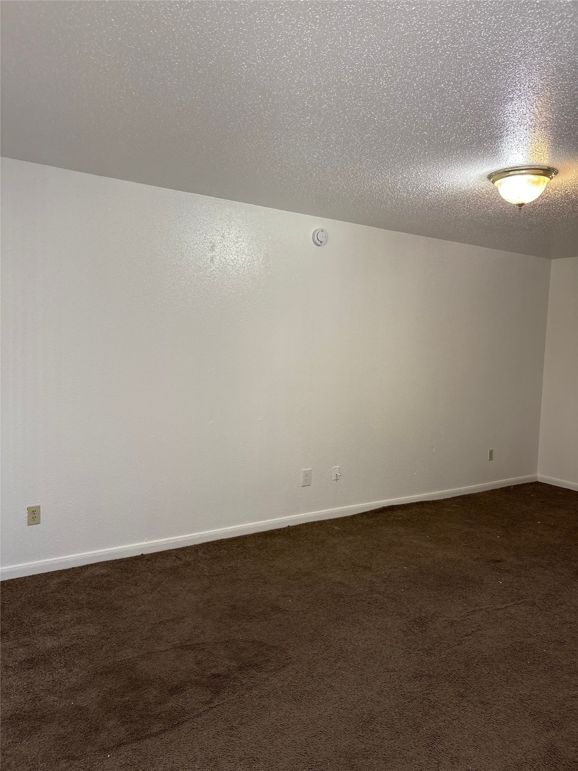 7201 Hallshire Drive, Unit 222 Houston, TX 77016 - Photo 7 of 20 an empty room with wooden floor and windows in it
