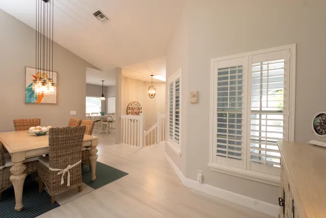 a workspace with wooden floor and a window
