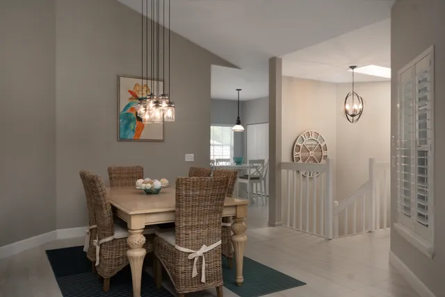 a dining room with furniture and window